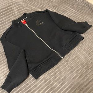 Nike women’s rally varsity jacket.